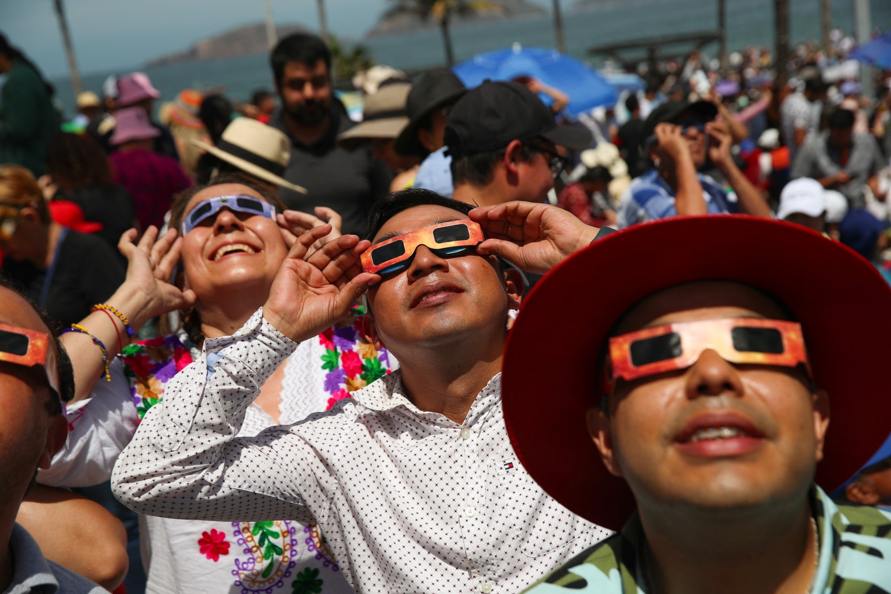 PHOTO: People use special protective glasses to observe a total solar eclipse in Mazatlan, Mexico April 8, 2024.