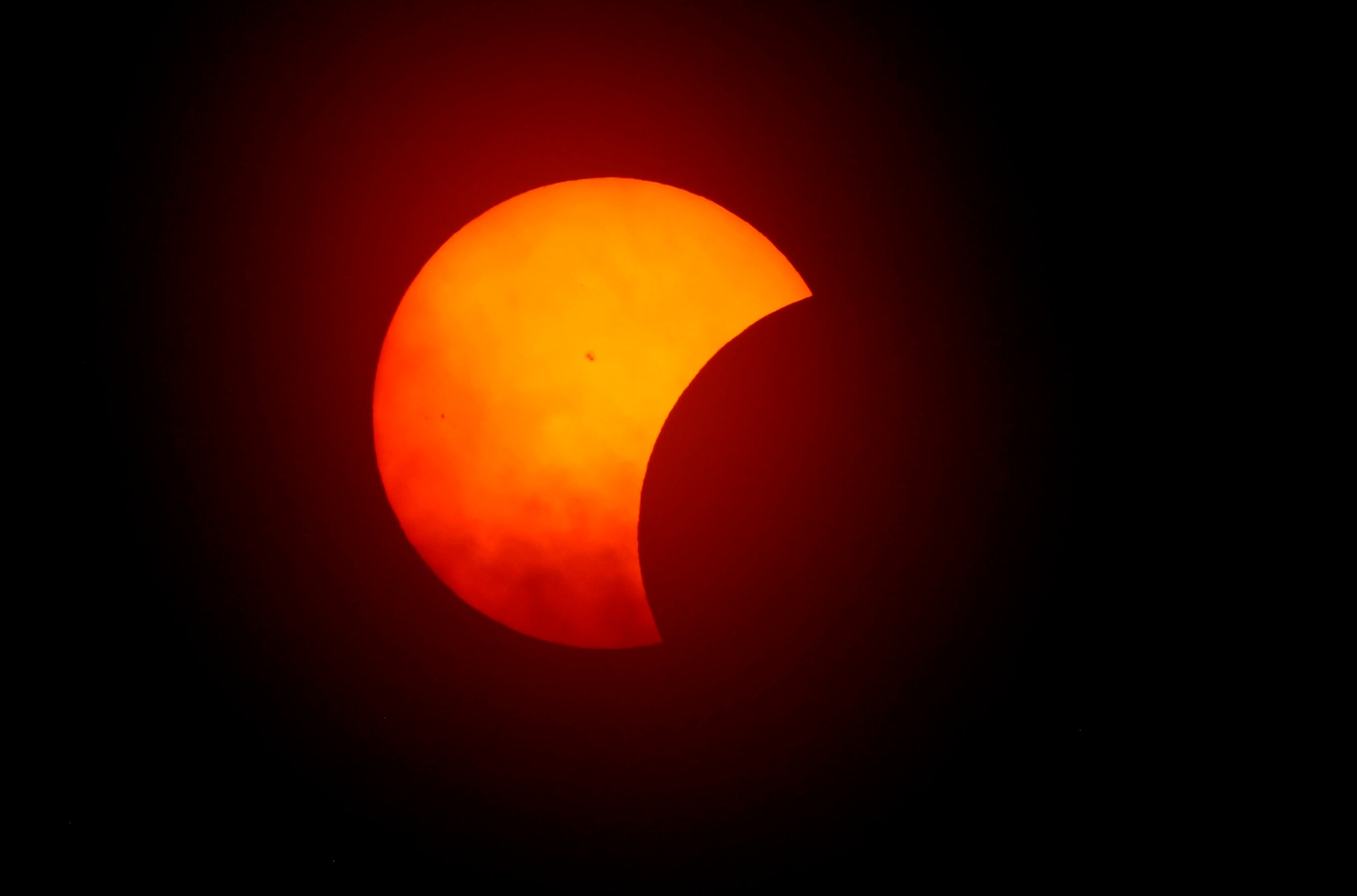 PHOTO: The moon begins to eclipse the sun on April 8, 2024 in Fort Worth, Texas.