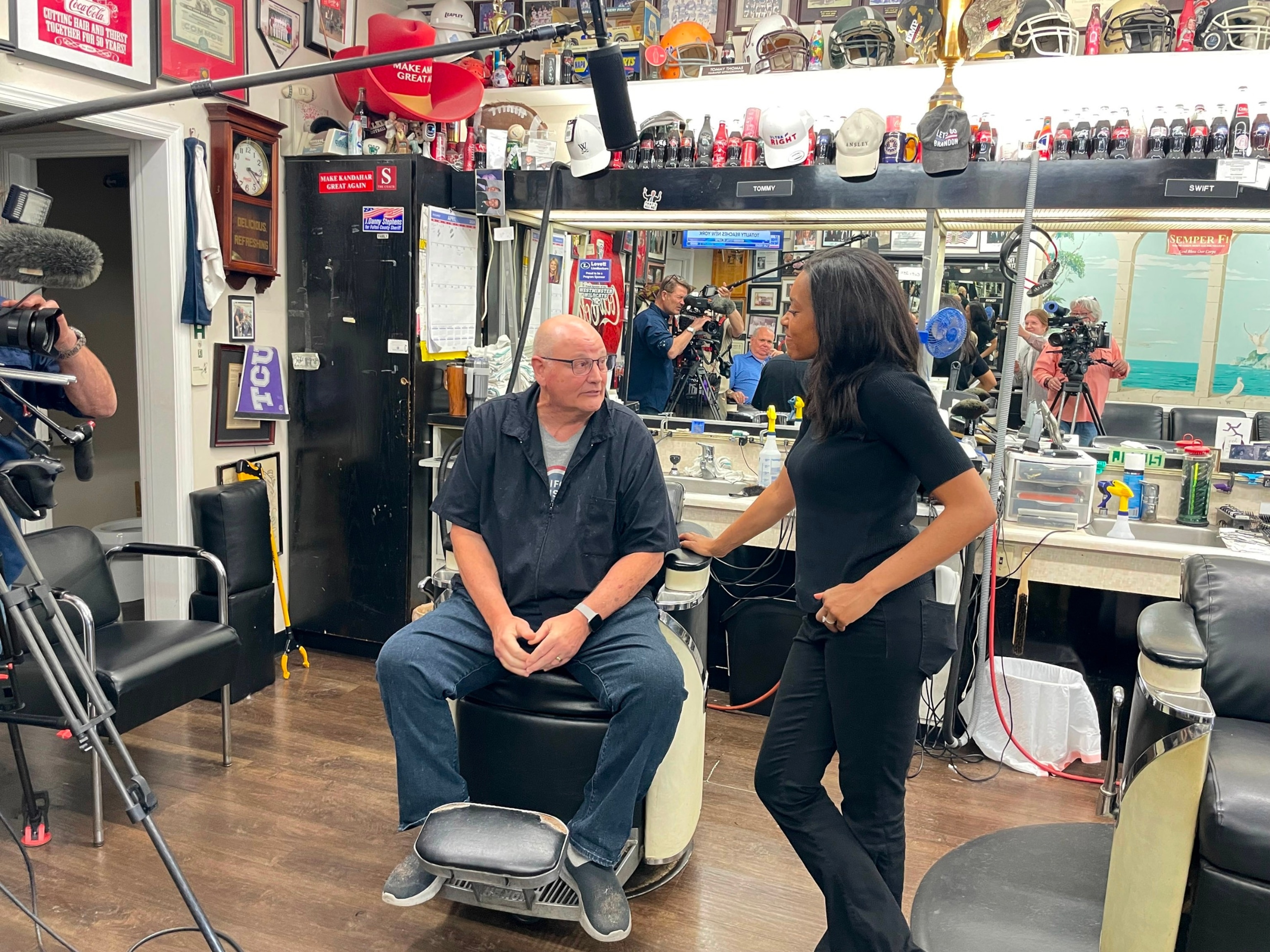 PHOTO: ABC's Rachel Scott interviews Thomas Barber Shop owner Tommy Thomas about the 2024 presidential election.